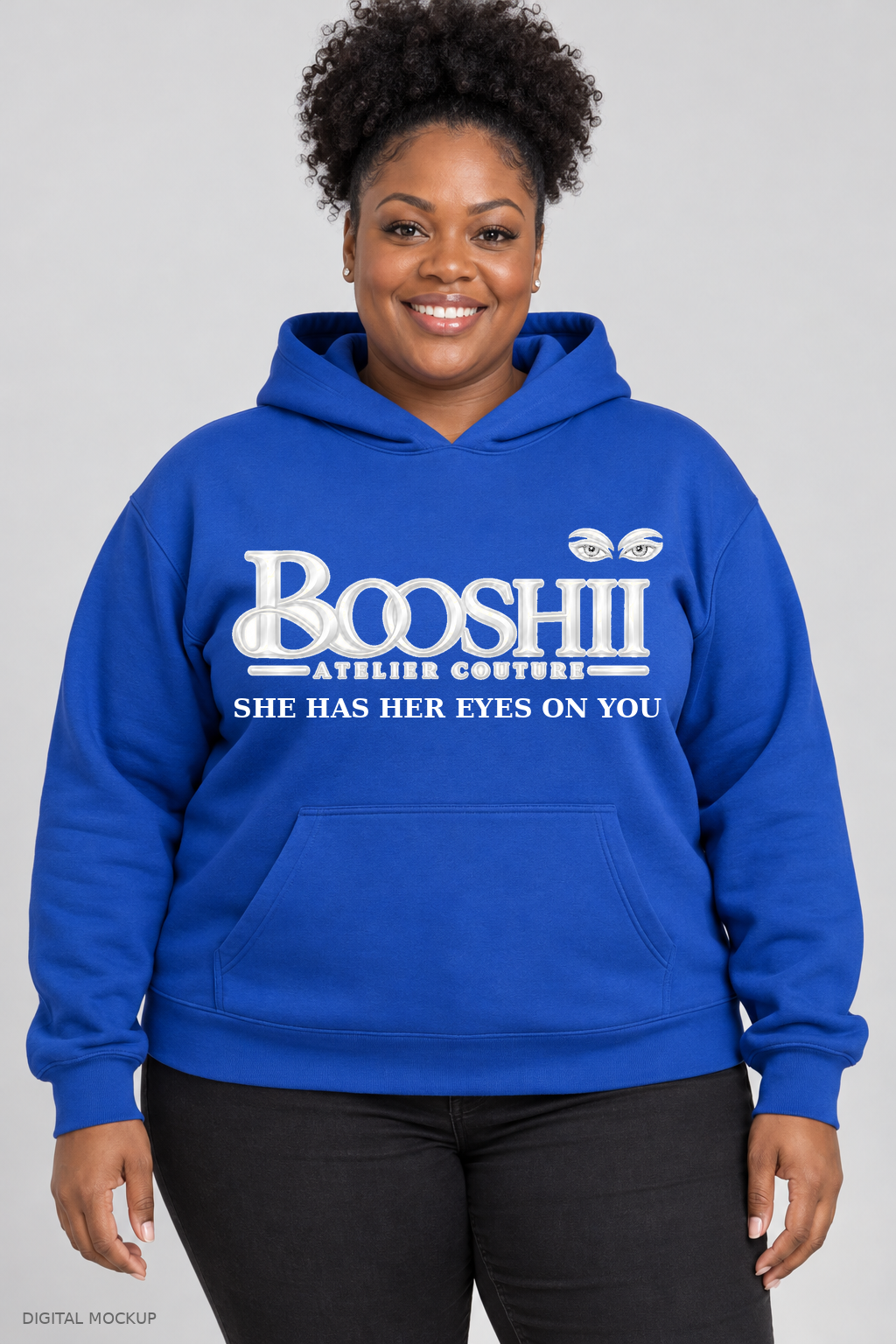 Digital mockup: BOOSHII royal blue hoodie with white signature and SHE HAS HER EYES ON YOU