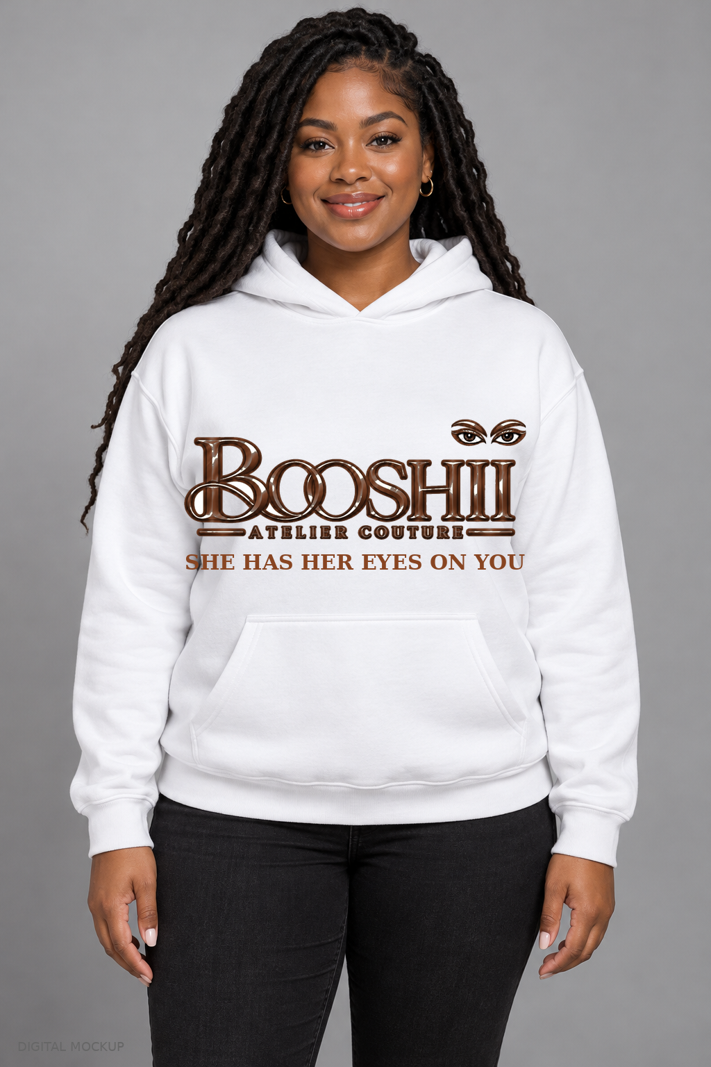 Digital mockup: BOOSHII white hoodie with Brown signature and SHE HAS HER EYES ON YOU