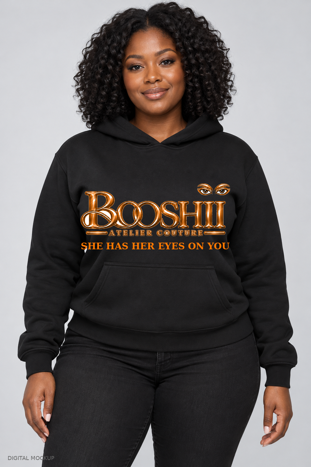 Digital mockup: BOOSHII black hoodie with Orange signature and SHE HAS HER EYES ON YOU