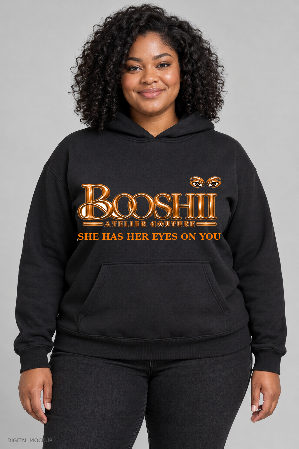 Digital mockup: BOOSHII black hoodie with Orange signature and SHE HAS HER EYES ON YOU