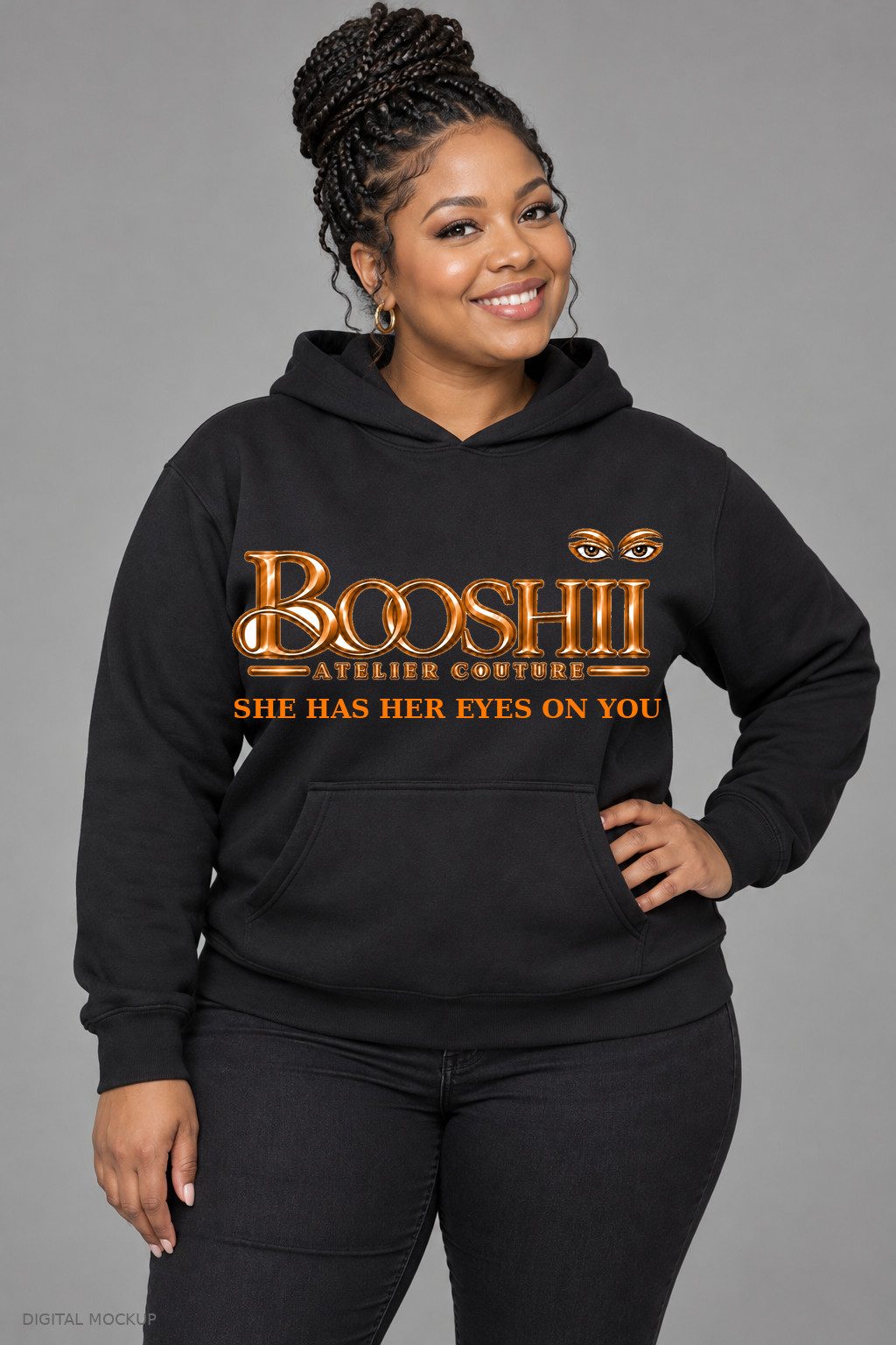 Digital mockup: BOOSHII She Has Her Eyes on You — Black Hoodie / Orange Signature, alternate model pose