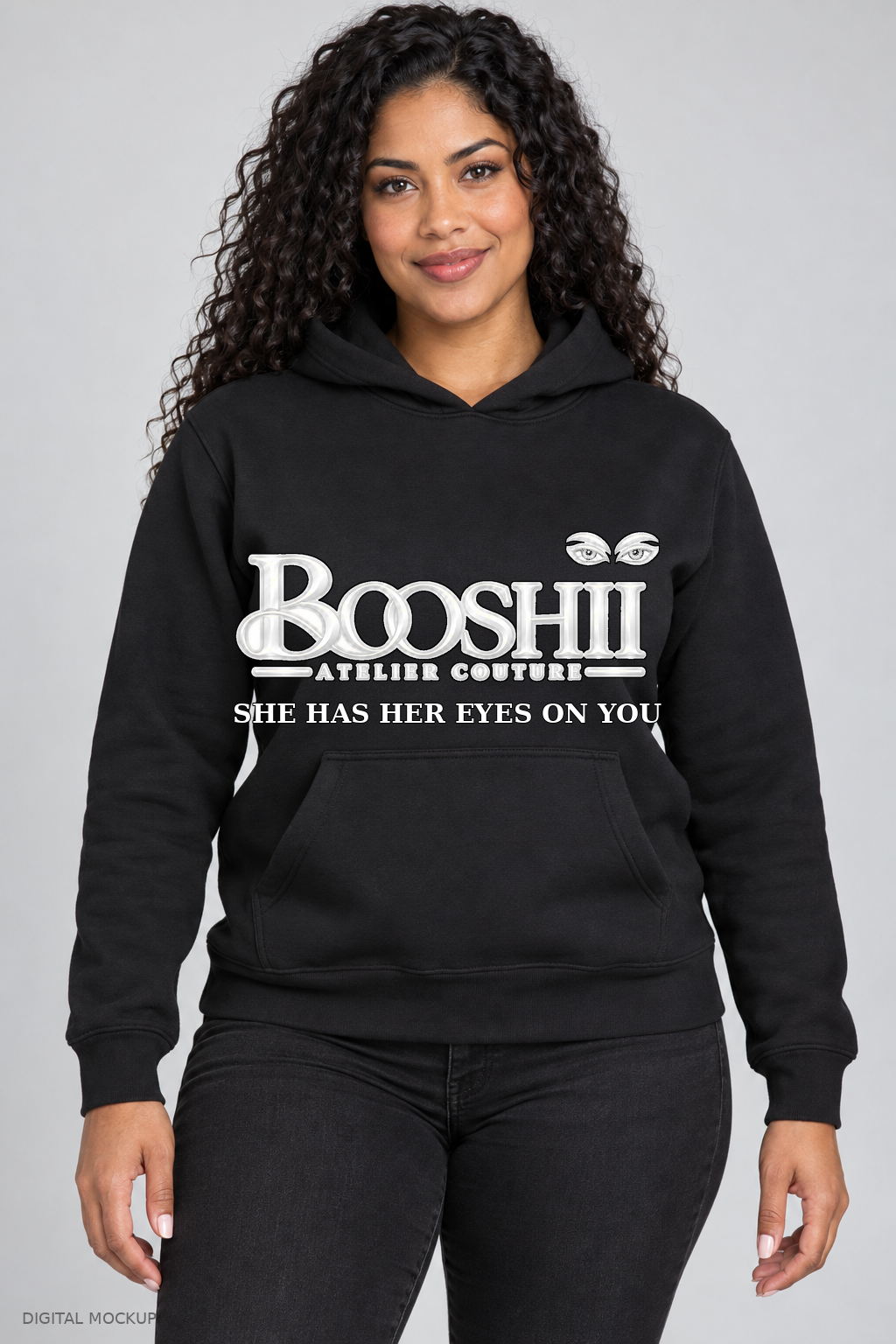 Digital mockup: BOOSHII black hoodie with White Black Trim signature and SHE HAS HER EYES ON YOU
