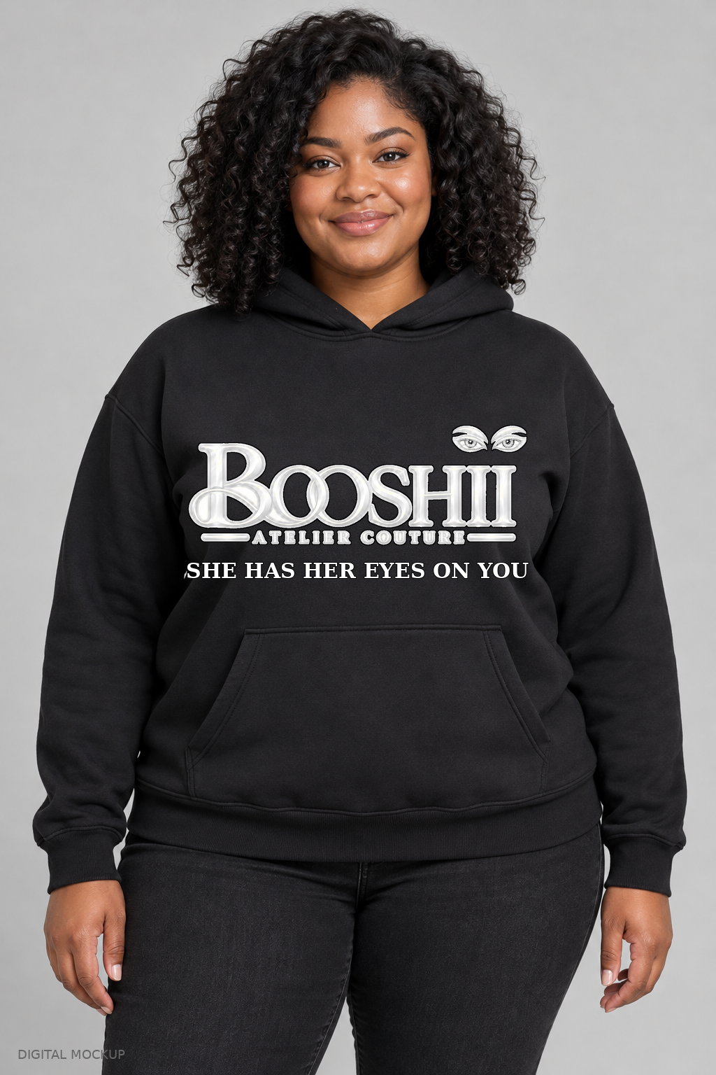 Digital mockup: BOOSHII black hoodie with White Black Trim signature and SHE HAS HER EYES ON YOU